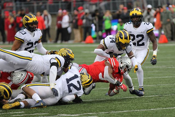 Tyree Kinnel (23), Devin Bush (10), Josh Ross (12), Josh Metellus (14), and David Long (22)