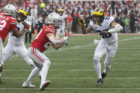 Khaleke Hudson (7) and Brandon Watson (28)