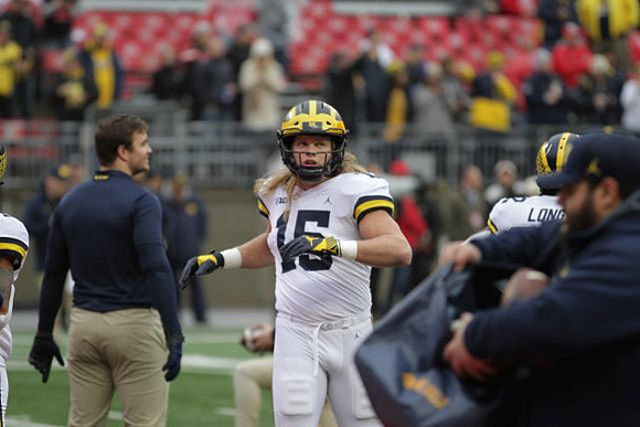 Chase Winovich (15) and David Long (22)