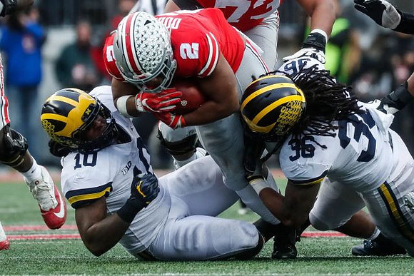 Devin Bush (10) and Devin Gil (36)