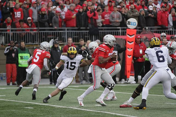 Chase Winovich (15) and Josh Uche (6)
