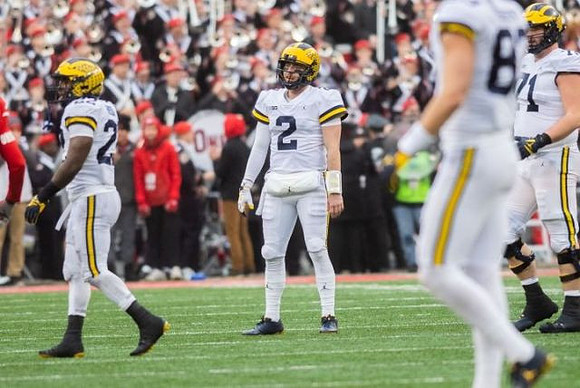 Karan Higdon (22), Shea Patterson (2), Zach Gentry (83), and Andrew Stueber (71)