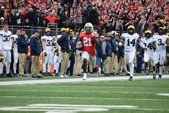 Josh Metellus (14), Lavert Hill (24), and Rashan Gary (3)