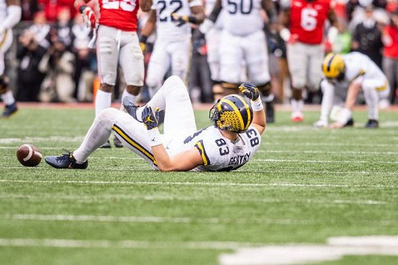 Zach Gentry (83), Karan Higdon (22), and Michael Onwenu (50)