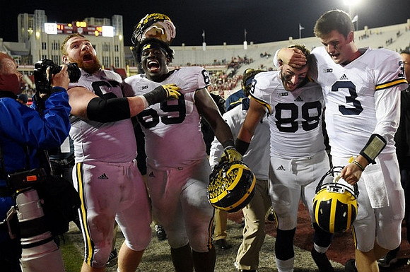 Kyle Kalis (67), Willie Henry (69), Jake Butt (88), and Wilton Speight (3)
