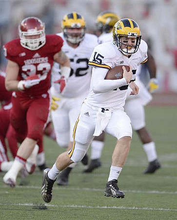 Jake Rudock (15) and Mason Cole (52)