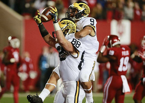Jake Butt (88) and Grant Perry (9)
