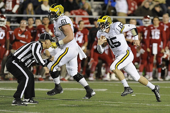 Graham Glasgow (61) and Jake Rudock (15)