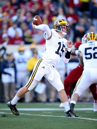 Jake Rudock (15) and Mason Cole (52)