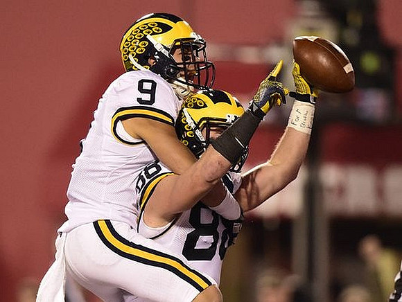 Grant Perry (9) and Jake Butt (88)