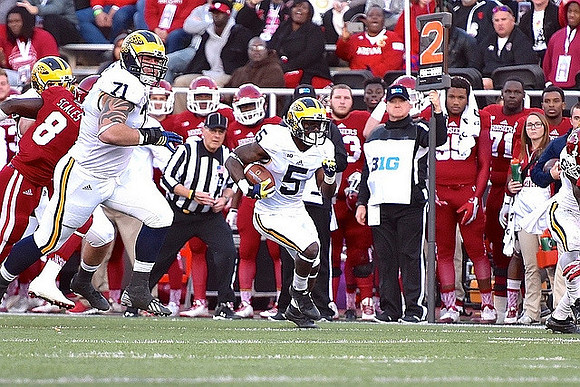 Ben Braden (71) and Jabrill Peppers (5)