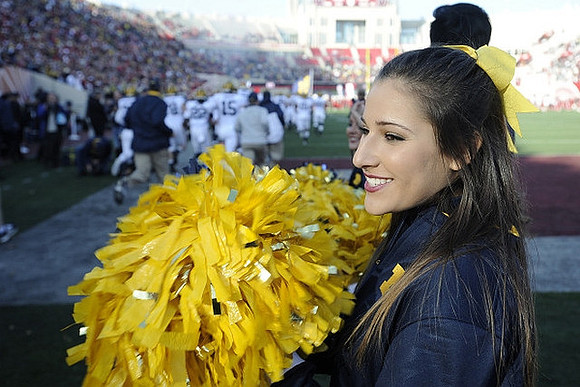 Cheerleader and Michigan Team