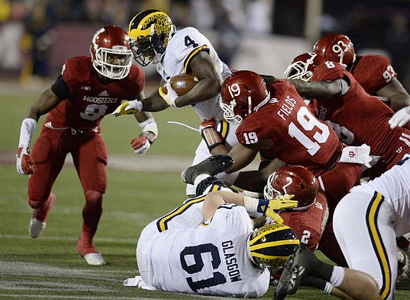 Graham Glasgow (61) and De'Veon Smith (4)