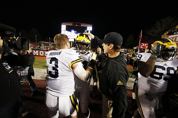 Desmond Morgan (3), Delano Hill (44), Jim Harbaugh, and Willie Henry (69)