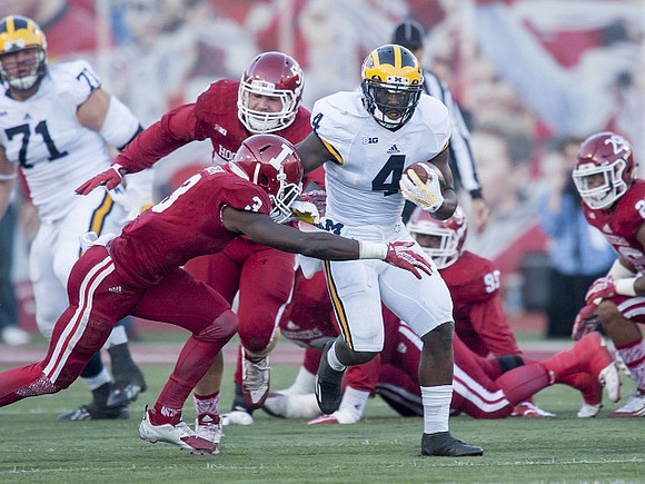 Ben Braden (71) and De'Veon Smith (4)