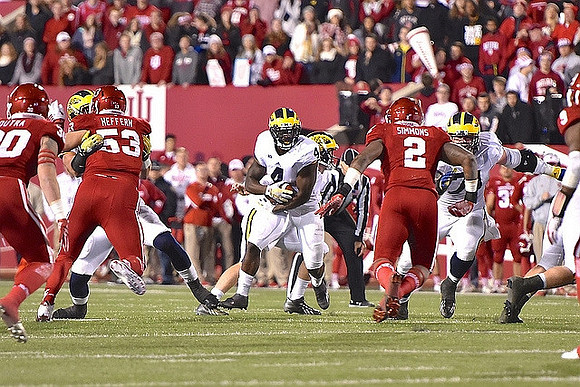De'Veon Smith (4) and Ben Braden (71)