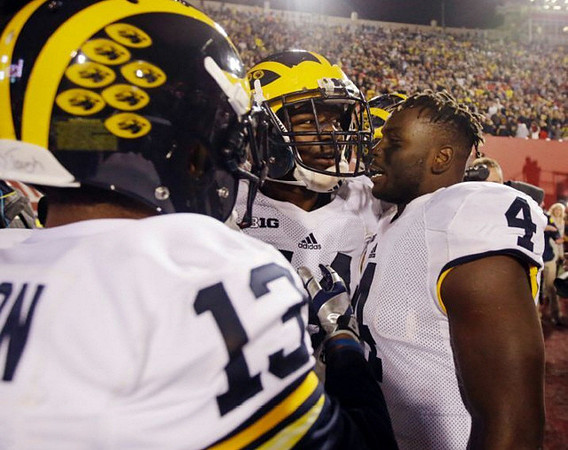 Matt Thompson (13), Delano Hill (44), and De'Veon Smith (4)