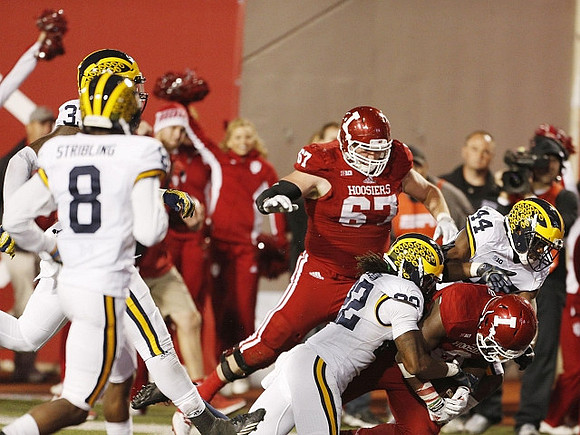 Channing Stribling (8), Jarrod Wilson (22), and Delano Hill (44)