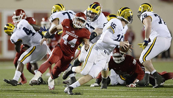De'Veon Smith (4), Ben Braden (71), Kyle Kalis (67), Jake Rudock (15), and Erik Magnuson (78)