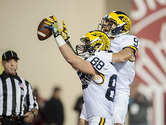Jake Butt (88) and Grant Perry (9)