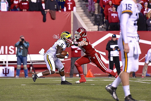 Jabrill Peppers (5) and Jake Rudock (15)