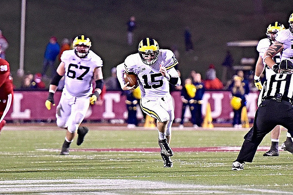 Kyle Kalis (67) and Jake Rudock (15)