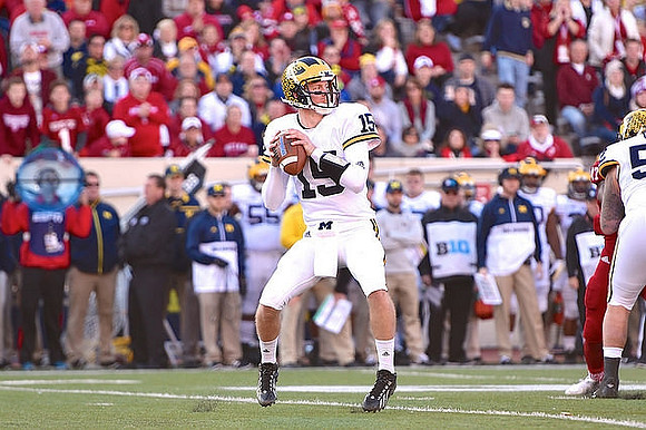 Jake Rudock (15) and Mason Cole (52)