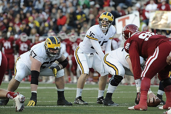 Kyle Kalis (67), Jake Rudock (15), and Graham Glasgow (61)
