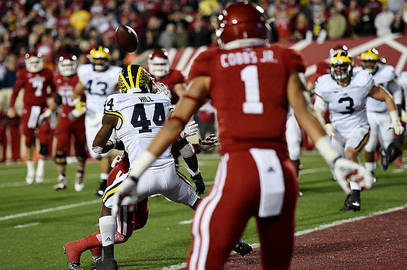 Delano Hill (44), Desmond Morgan (3), and Chris Wormley (43)