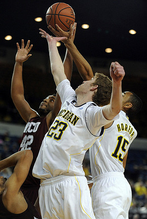 Evan Smotrycz (23) and Jon Horford (15)