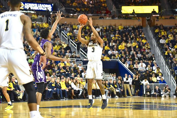 Charles Matthews (1) and Zavier Simpson (3)