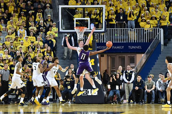 Charles Matthews (1), Zavier Simpson (3), Isaiah Livers (4), Jon Teske (15), and Eli Brooks (55)