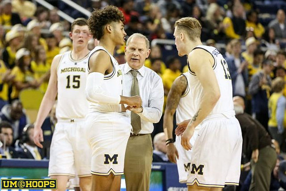 Jon Teske (15), Jordan Poole (2), John Beilein, and Ignas Brazdeikis (13)