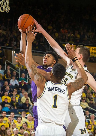 Charles Matthews (1) and Jon Teske (15)