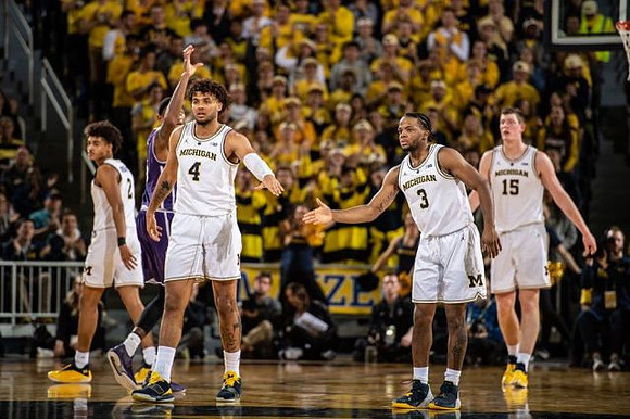 Jordan Poole (2), Isaiah Livers (4), Zavier Simpson (3), and Jon Teske (15)