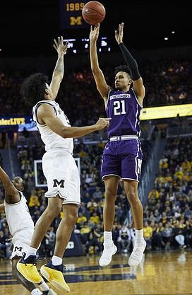 Zavier Simpson (3) and Eli Brooks (55)