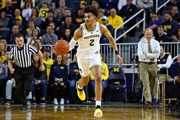 Jordan Poole (2) and John Beilein