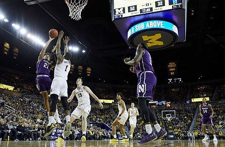 Charles Matthews (1), Jon Teske (15), Jordan Poole (2), and Ignas Brazdeikis (13)