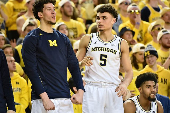 Brandon Johns Jr. (23), Adrien Nunez (5), and David DeJulius (0)