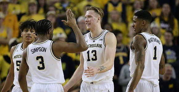 Eli Brooks (55), Zavier Simpson (3), Ignas Brazdeikis (13), and Charles Matthews (1)