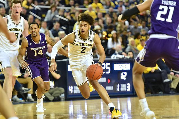 Jon Teske (15) and Jordan Poole (2)