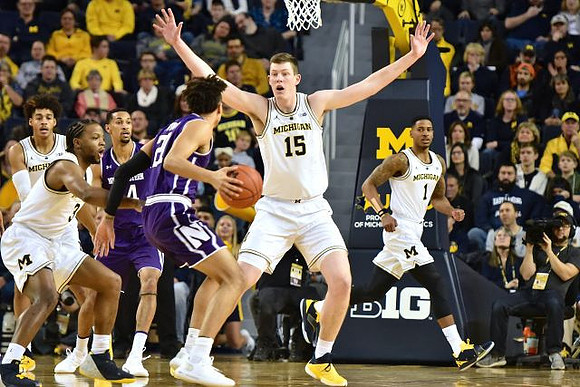 Jordan Poole (2), Zavier Simpson (3), Jon Teske (15), and Charles Matthews (1)