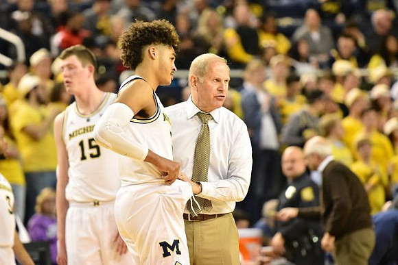 Jon Teske (15), Jordan Poole (2), and John Beilein