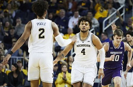 Jordan Poole (2) and Isaiah Livers (4)