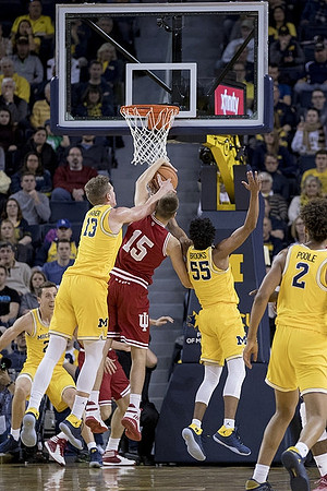 Duncan Robinson (22), Moritz Wagner (13), Eli Brooks (55), and Jordan Poole (2)