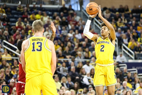 Moritz Wagner (13) and Jordan Poole (2)