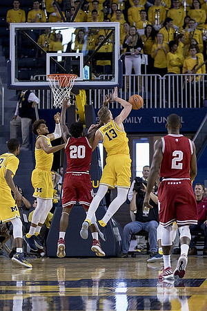 Muhammad-Ali Abdur-Rahkman (12), Isaiah Livers (4), and Moritz Wagner (13)
