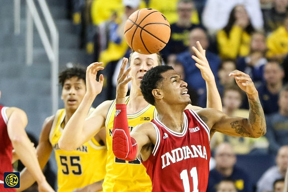 Eli Brooks (55) and Duncan Robinson (22)