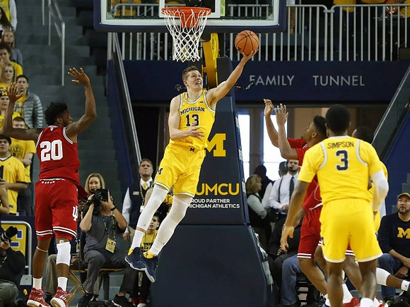 Moritz Wagner (13) and Zavier Simpson (3)