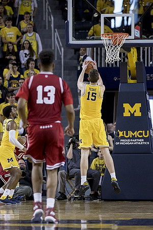 Jon Teske (15) and Zavier Simpson (3)